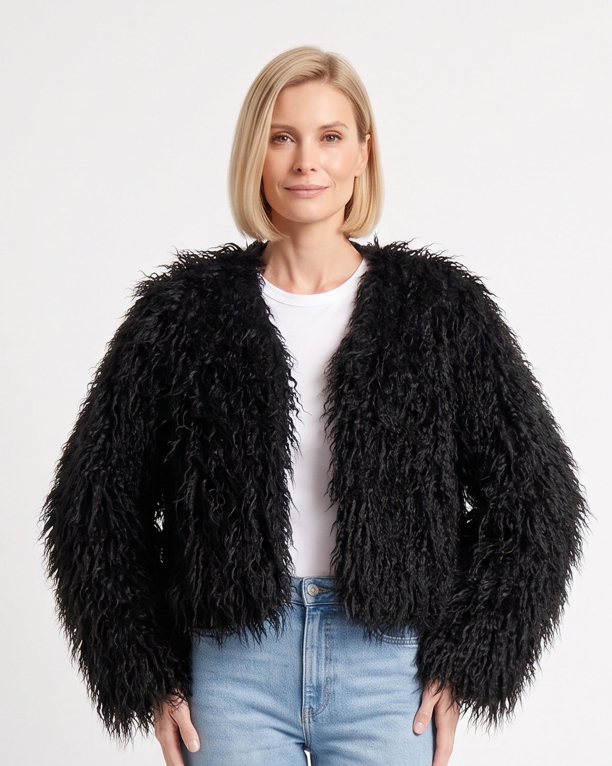 Black cropped shaggy faux fur jacket with an open front and long sleeves