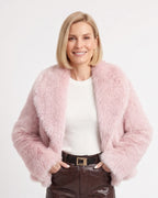 Light pink cropped faux fur jacket with wide lapel collar, open front, long sleeves