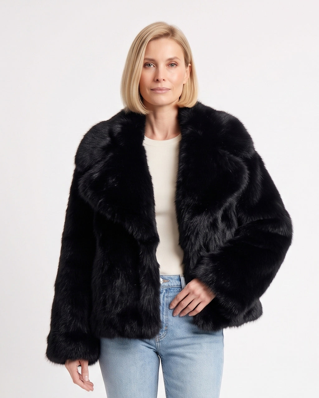 Black cropped faux fur jacket with oversized lapel collar and long sleeves