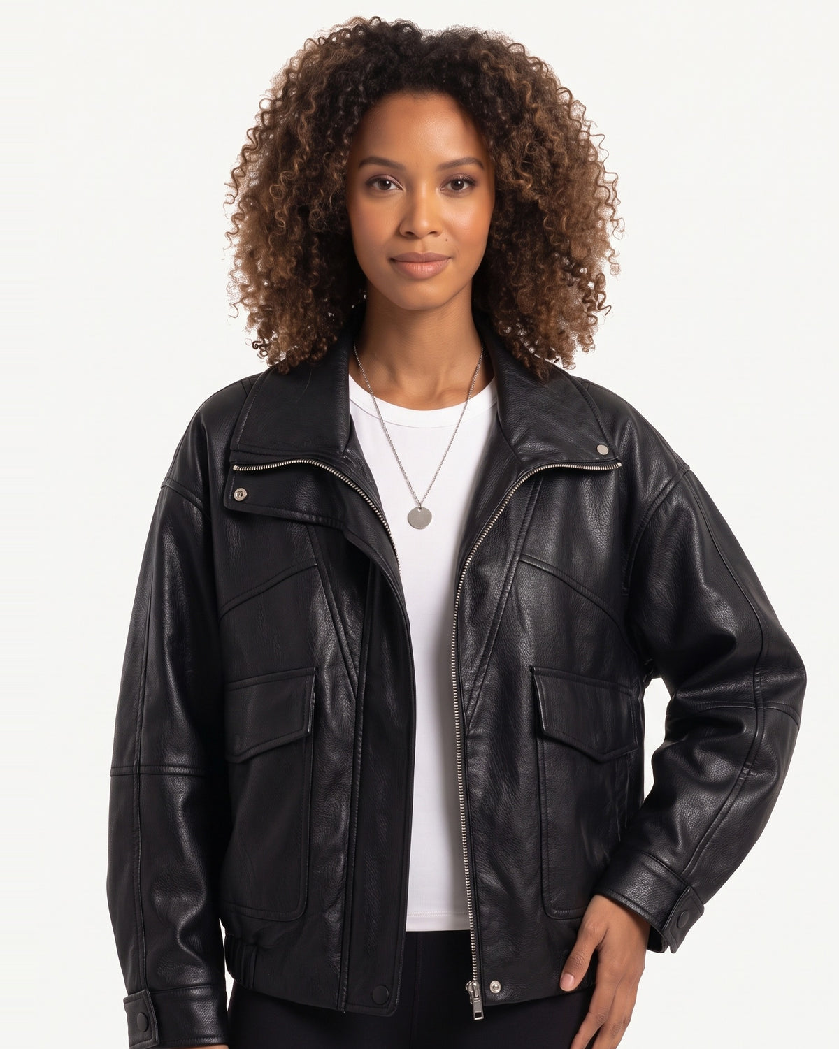 Black faux leather jacket with stand collar, front zip, and flap chest pockets