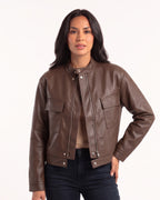 Brown cropped faux leather jacket with band collar, snap placket, and two flap pockets