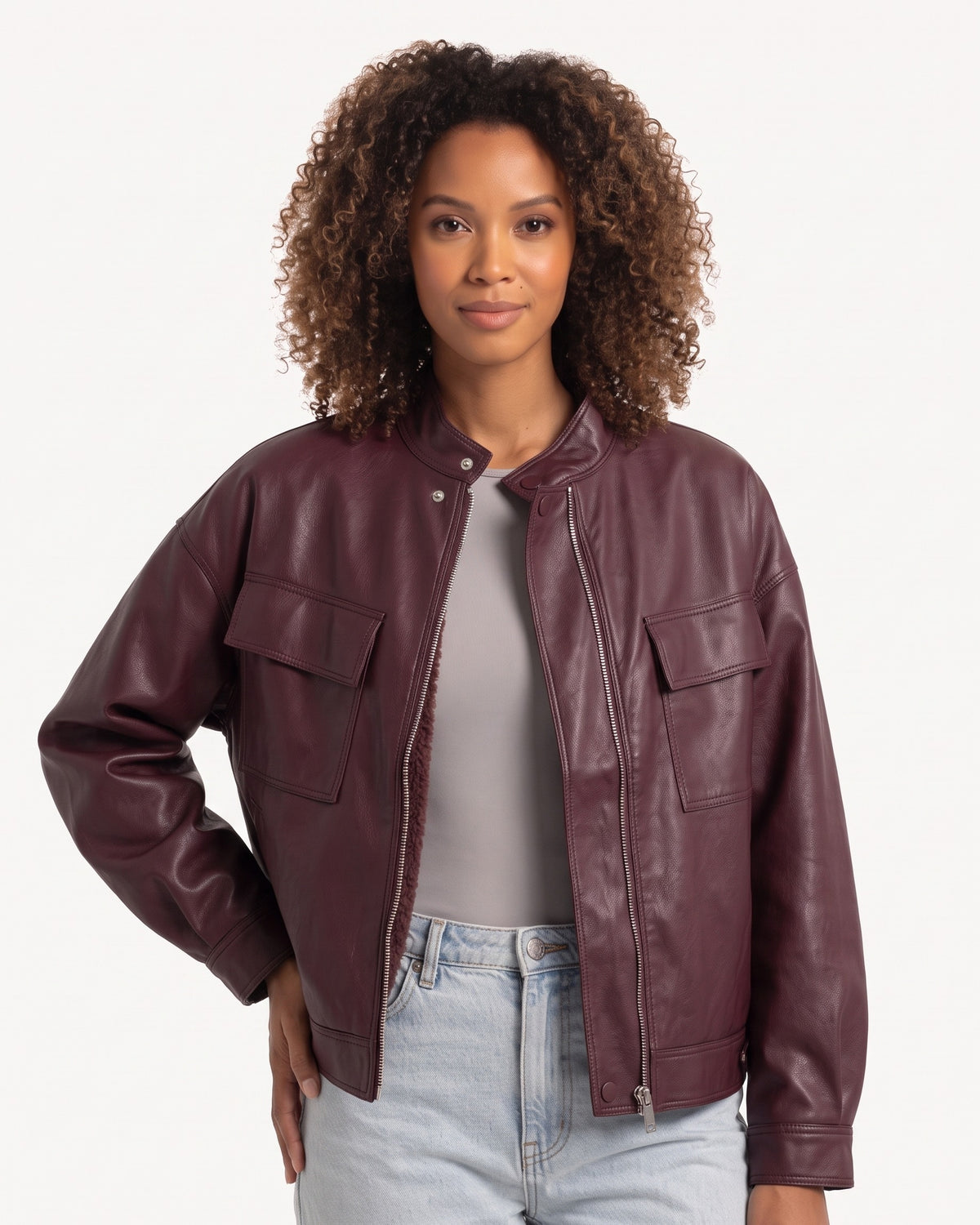 Burgundy cropped faux leather jacket with stand collar, zip front, flap pockets