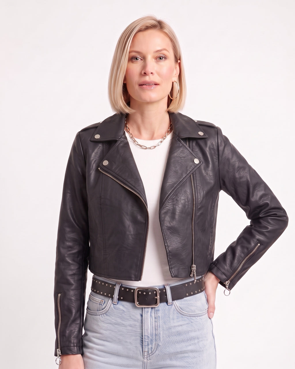 Black cropped faux leather moto jacket with front zipper, snap lapels, and zipped pockets