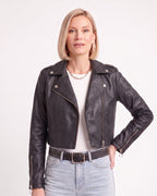 Black cropped faux leather moto jacket with front zipper, snap lapels, and zipped pockets