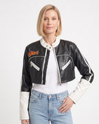 Cropped black faux leather racer jacket with white contrast trim, zip pockets, stand collar