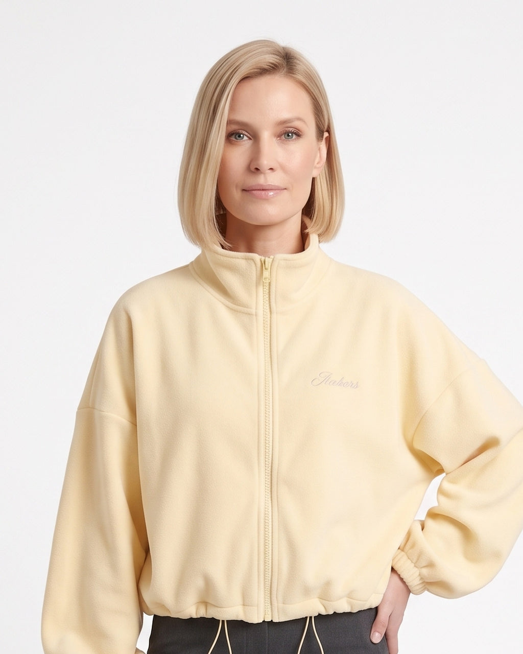Women’s light yellow cropped fleece jacket, full-zip stand collar, drawstring hem
