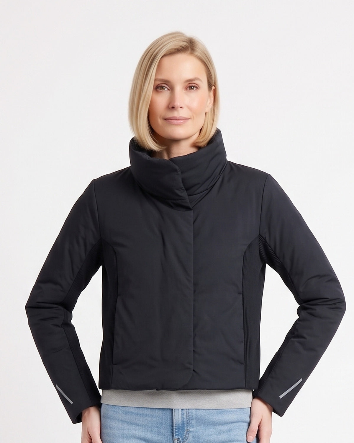 Women's cropped black puffer jacket with funnel neck and ribbed side panels