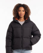 Hooded puffer jacket in black with full front zipper and raised, insulated collar.