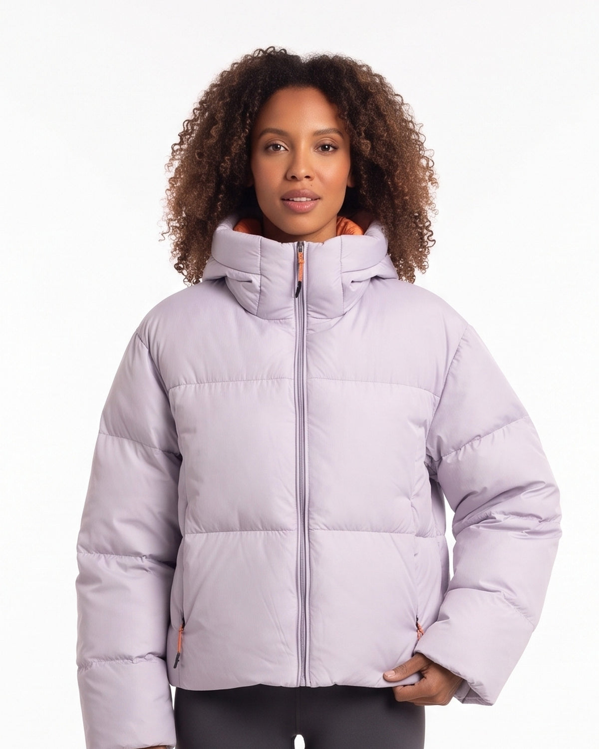 Cropped hooded puffer jacket in light purple with full front zipper and thick quilting.
