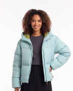Hooded puffer jacket in light blue with full front zipper and side hand pockets.
