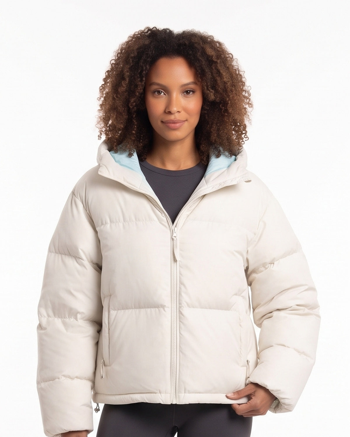 Cropped hooded puffer jacket in off-white with full front zipper and quilted insulation.