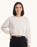 Off-white cropped crewneck sweatshirt with oversized long sleeves and ribbed cuffs