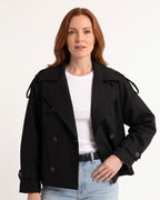 Black cropped trench coat with double-breasted buttons and belted waist, adjustable cuff tabs