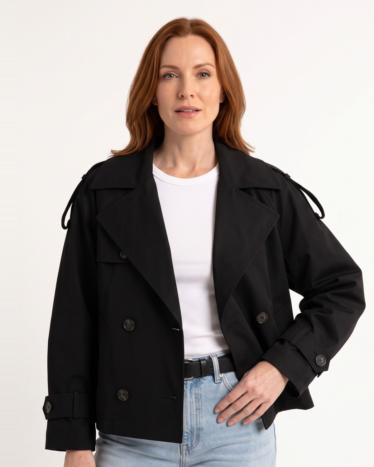 Black cropped trench coat with double-breasted buttons and belted waist, adjustable cuff tabs