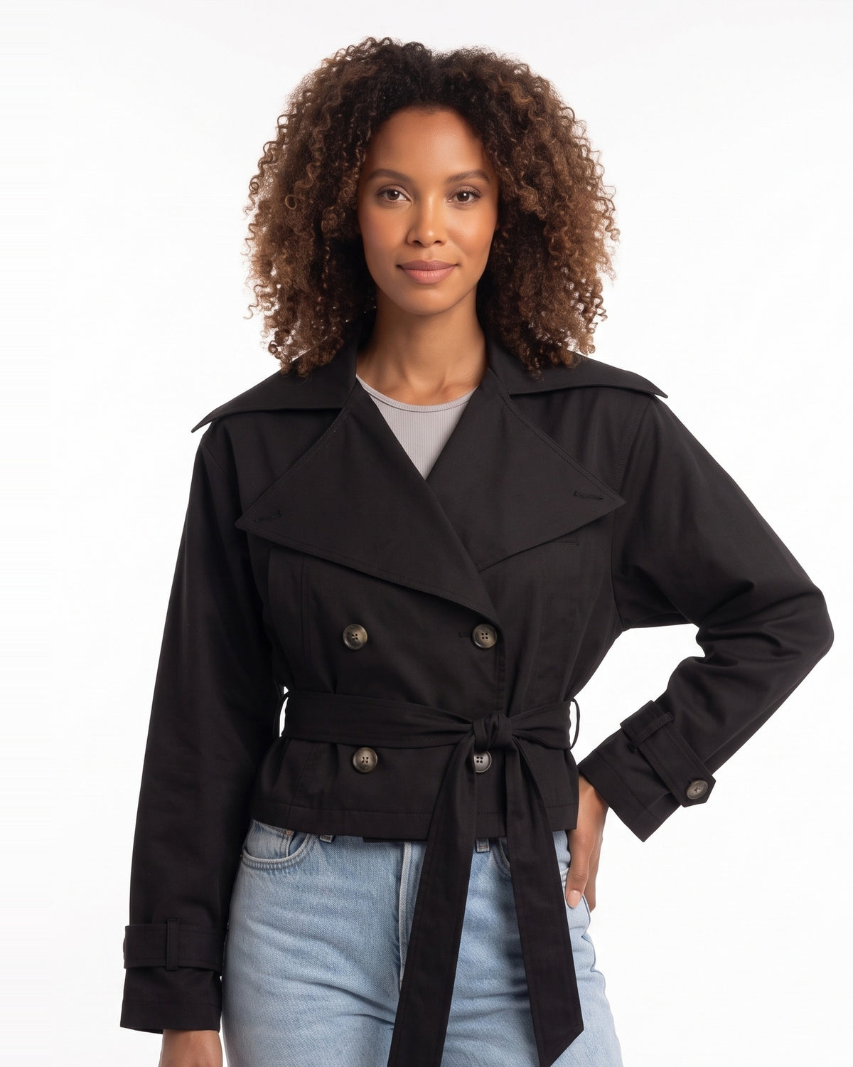 Black cropped trench jacket with wide collar, double-breasted button front, tied belt