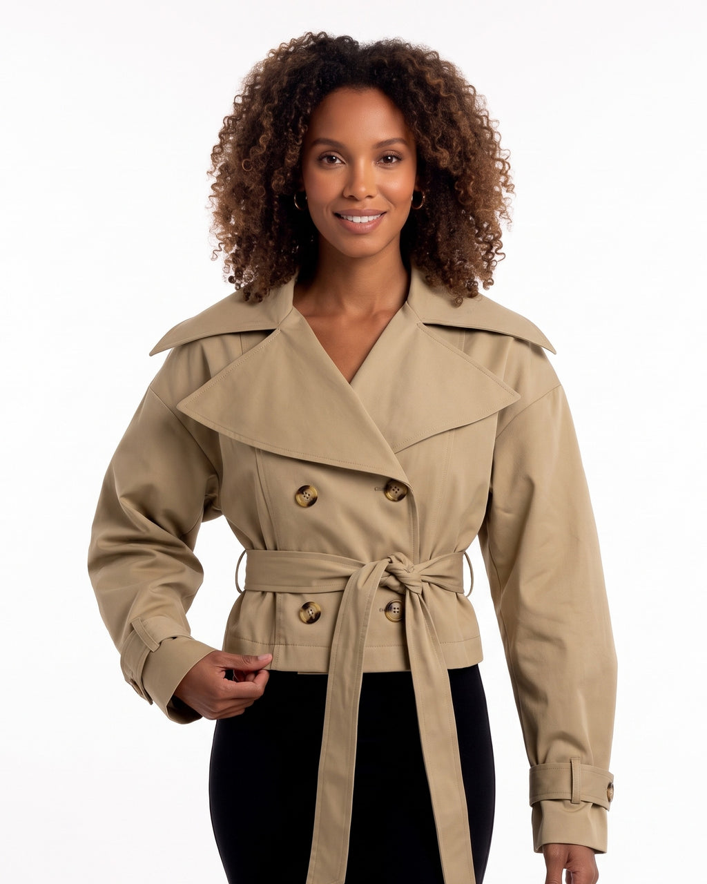Tan cropped trench jacket with wide collar, double-breasted button front, tied belt
