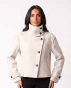 Cropped wool jacket, funnel neck, asymmetric buttons, tab cuffs, off-white