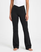 Black high-waisted V-crossover flare yoga leggings with bootcut fit