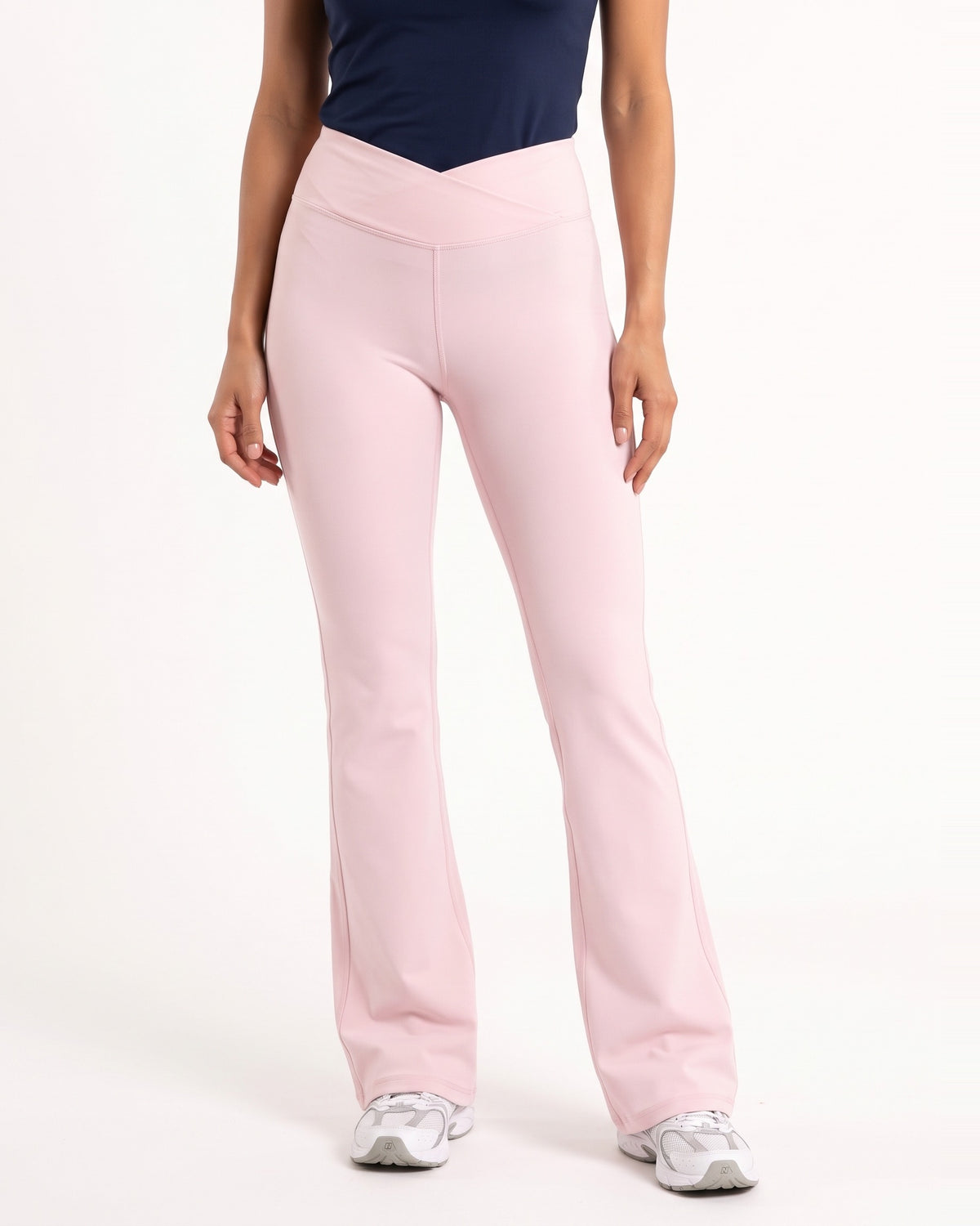 Pink high-waisted V-crossover flare yoga leggings with bootcut fit