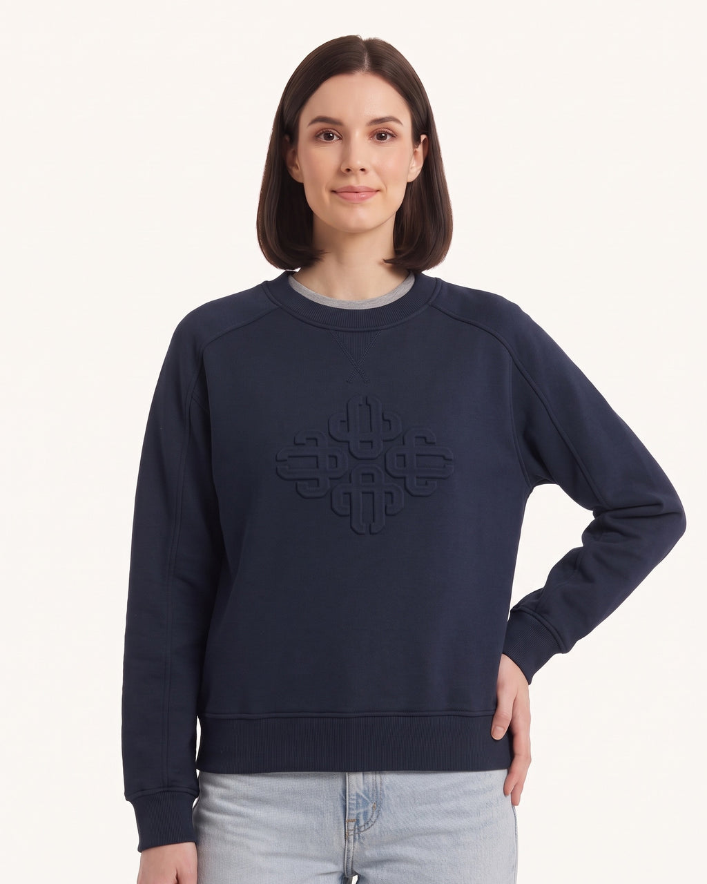 Women’s navy crewneck sweatshirt with embossed geometric logo and raglan sleeve seams