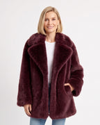 Burgundy mid-length faux fur coat with wide notch lapels and side pockets