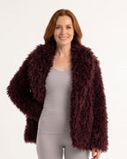 Burgundy shaggy faux fur jacket with shawl lapel and open front, long sleeves