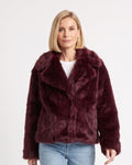 Burgundy shaggy faux fur short coat with wide lapel collar, model-worn front view