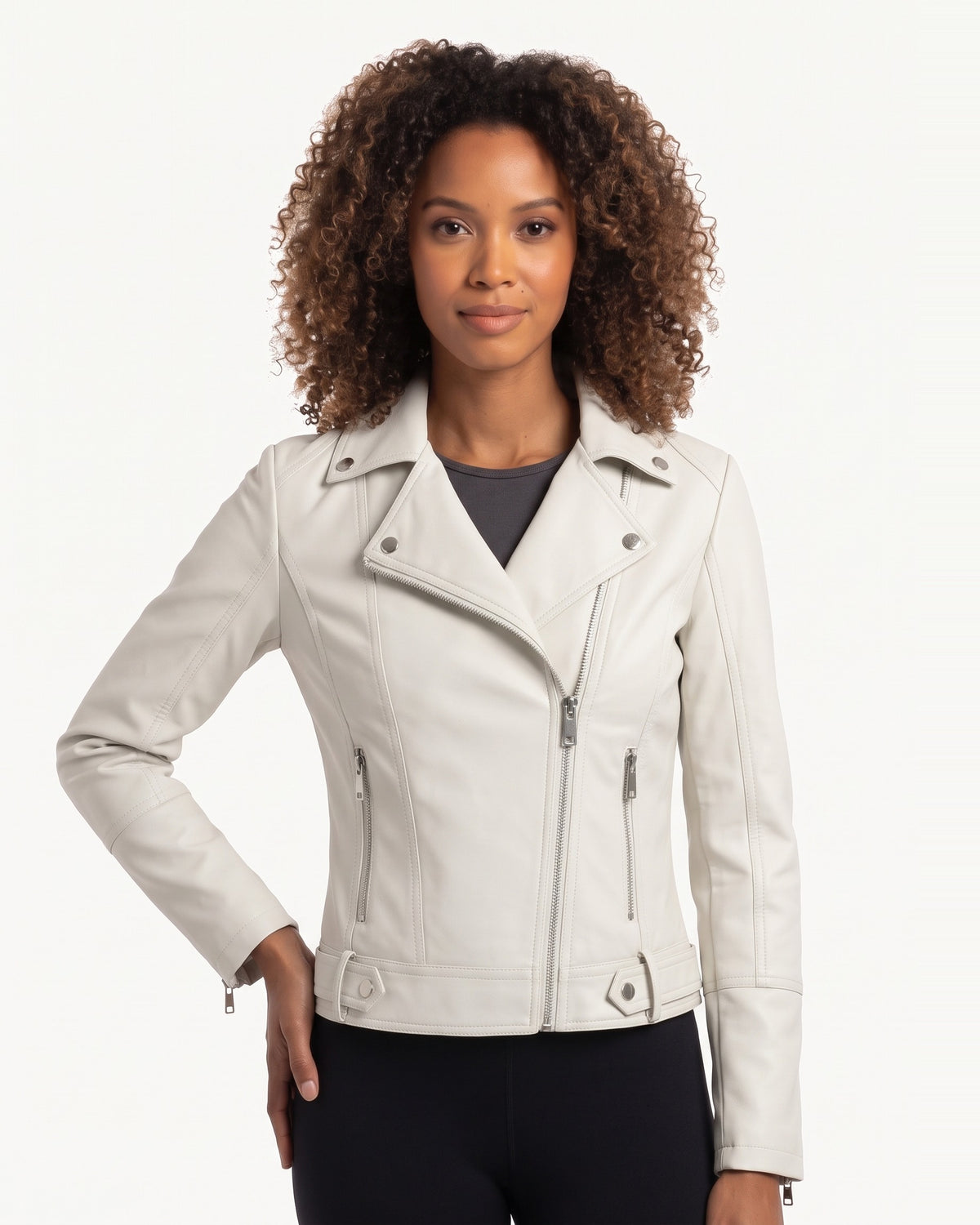 White moto jacket on model, asymmetrical zip front, snap collar, zip pocket accents.