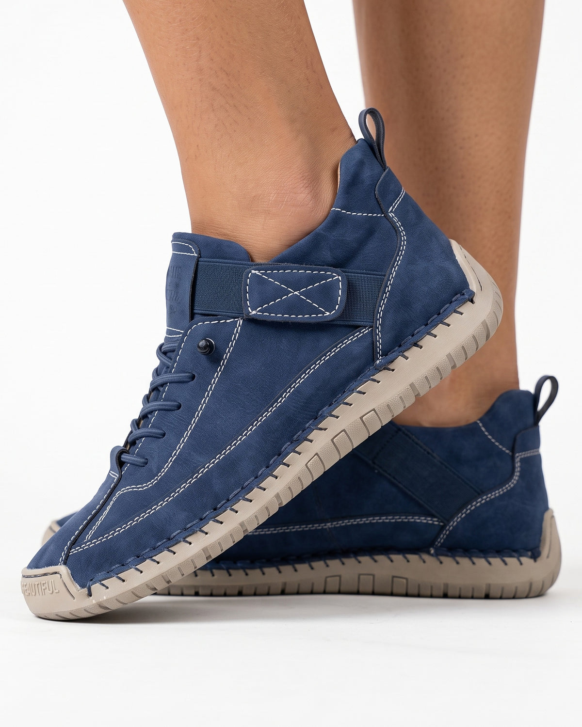 Blue faux leather lace-up sneaker with ankle strap and chunky rubber sole