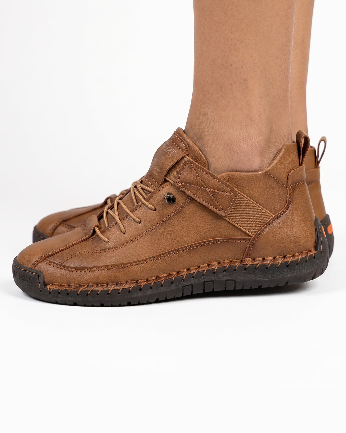 Brown faux leather lace-up sneaker with ankle strap and rugged rubber outsole
