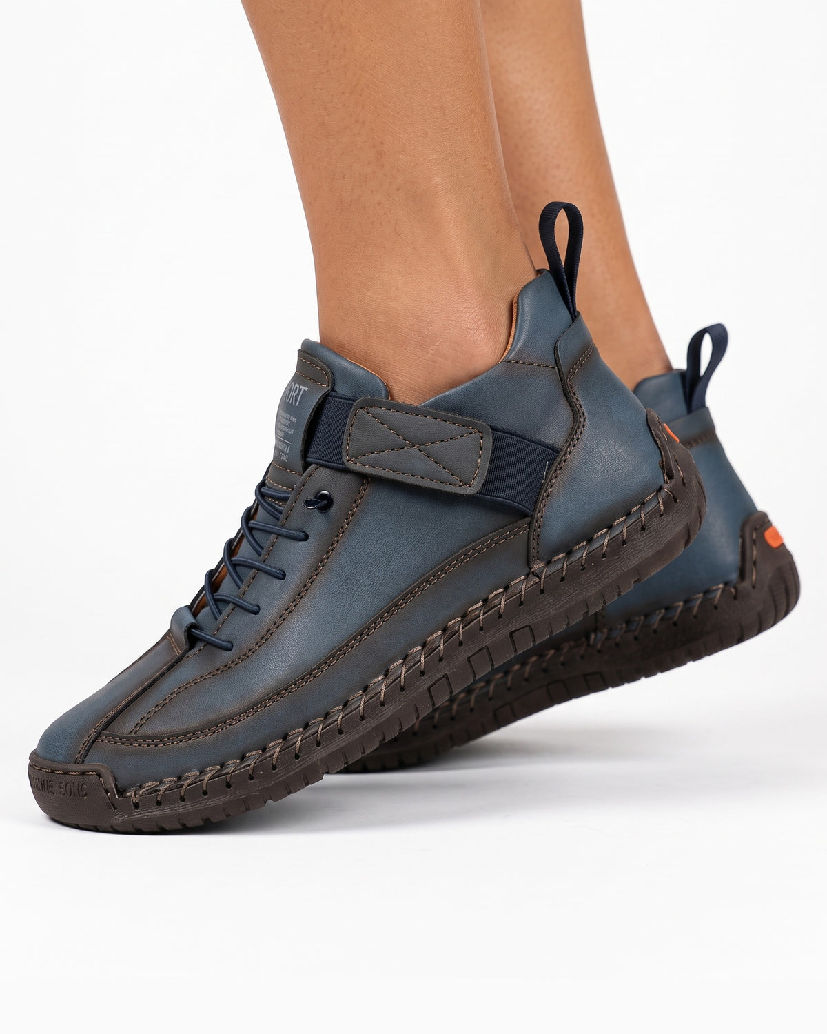 Dark blue faux leather lace-up sneaker with ankle strap and rugged outsole