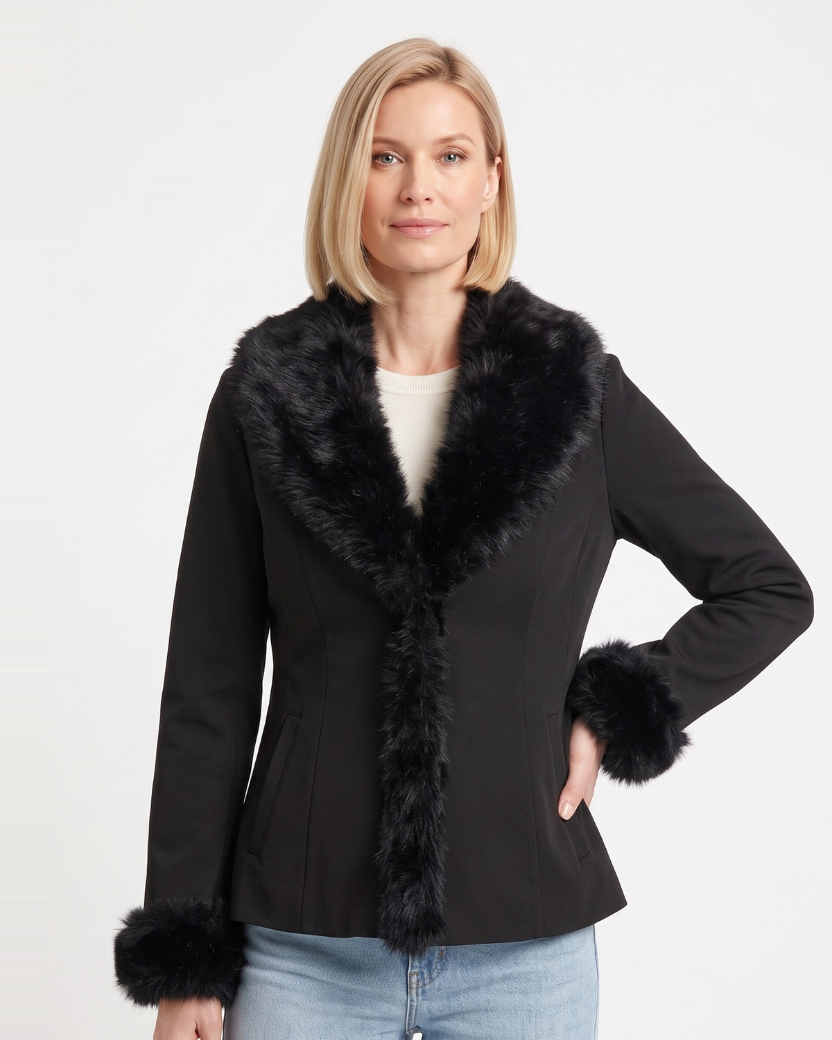 Women’s black fitted jacket with faux-fur collar, long sleeves, and fluffy cuff trim