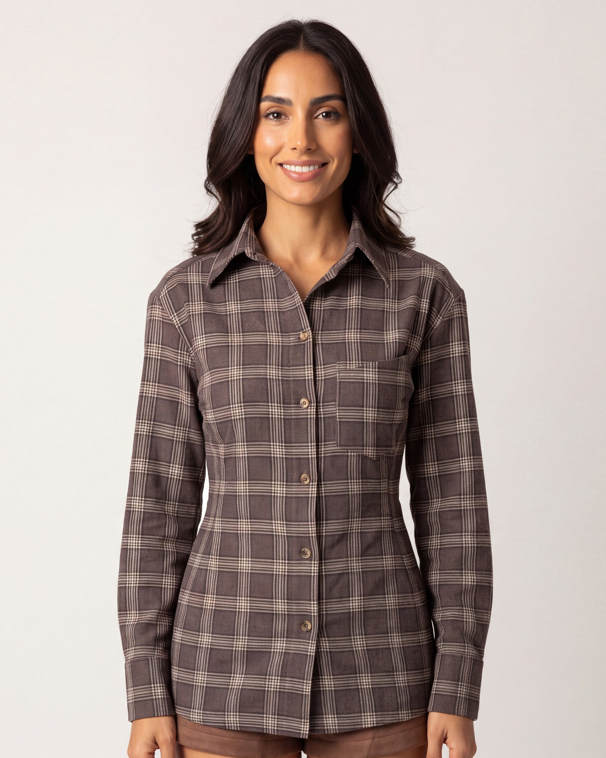Brown plaid button-down shirt with chest pockets and curved cinched waist
