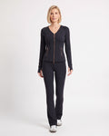 Black workout set with zip-front jacket and flared leggings, shown from the front