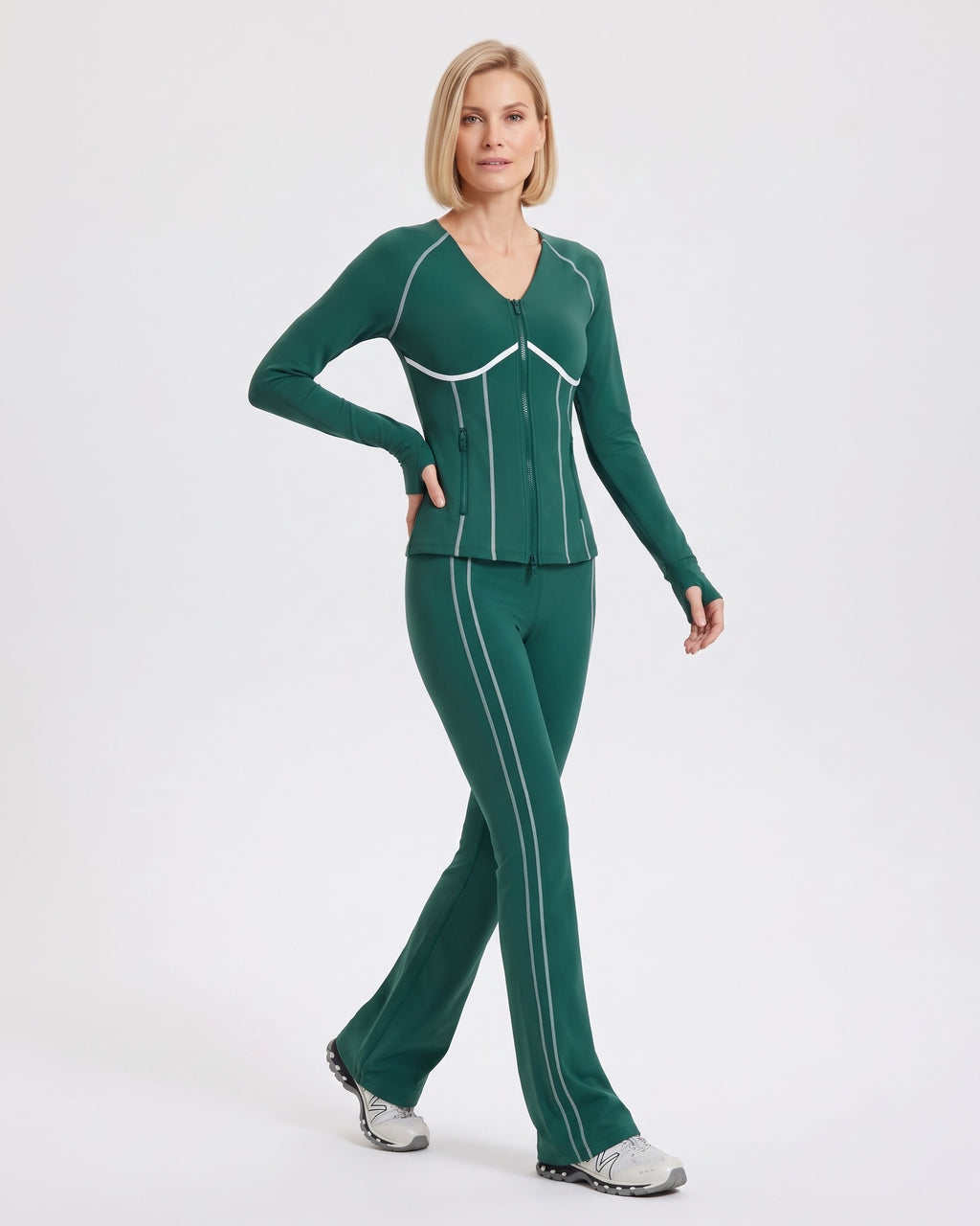 Dark green workout set with white piping, shown in a walking pose