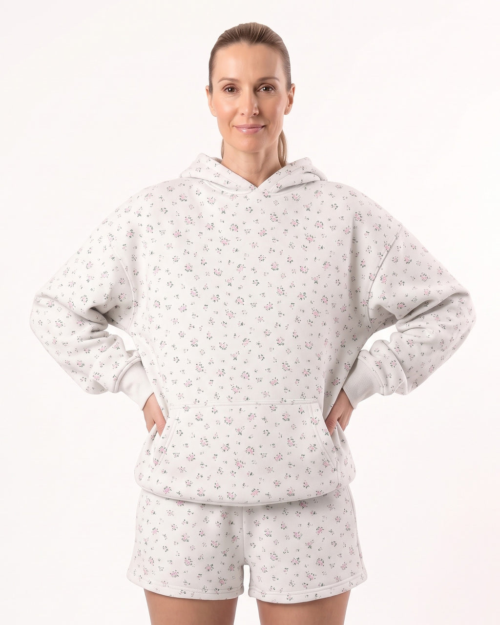 Women's white floral fleece hoodie and shorts set with drawstring hood and relaxed fit