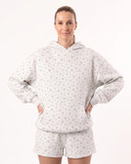 Women's white floral fleece hoodie and shorts set with drawstring hood and relaxed fit