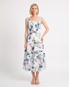 White floral midi dress with blue flowers, square neckline, wide straps and an A-line skirt