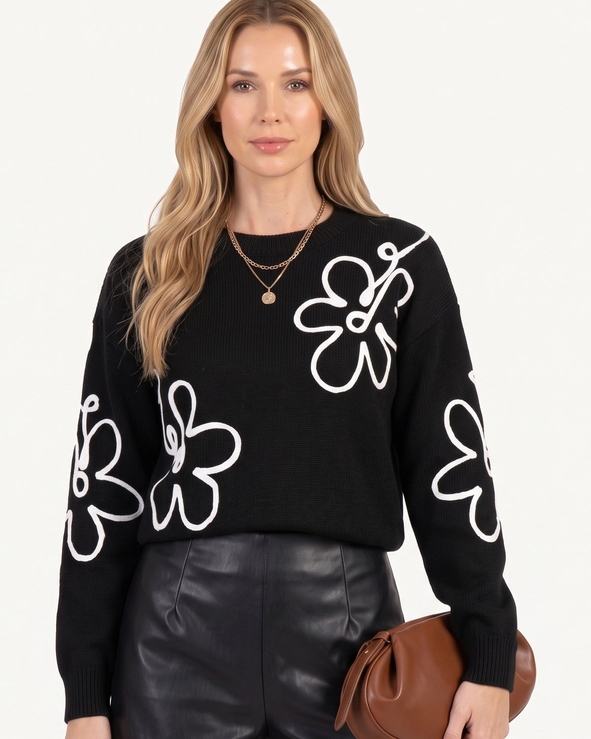Black crew neck sweater with white daisy embroidery, long sleeve pullover