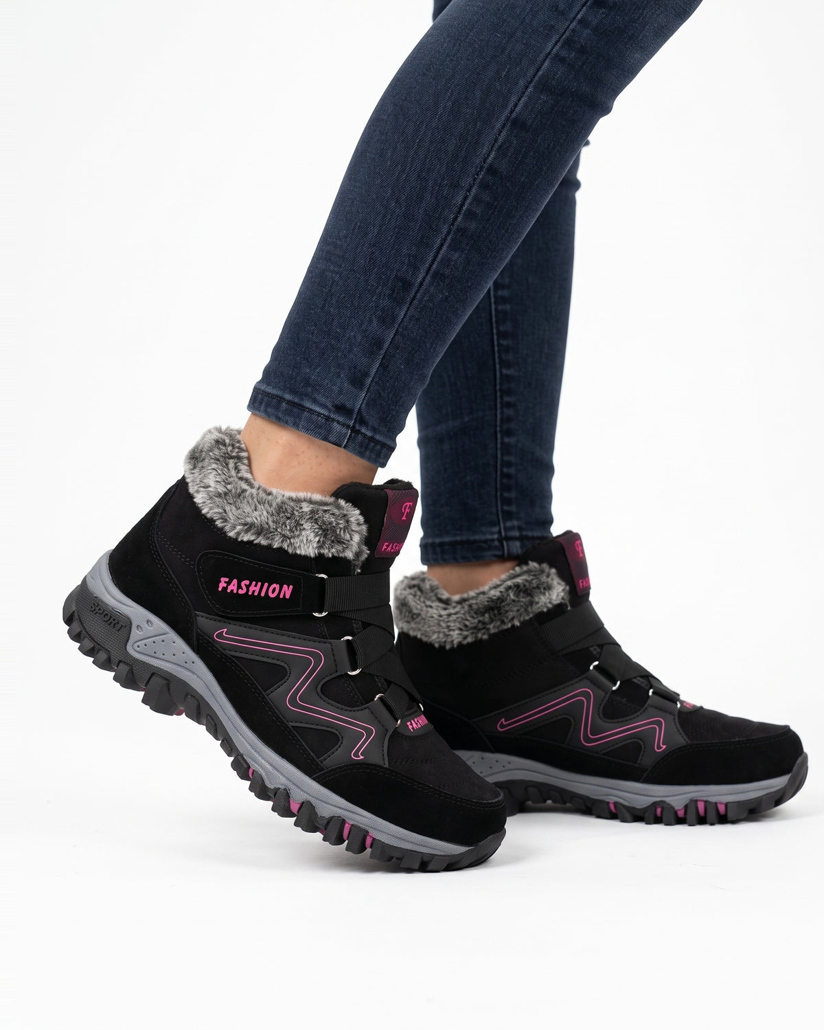 Women’s black fur-lined snow boots with pink accents, hook-and-loop straps, lug sole