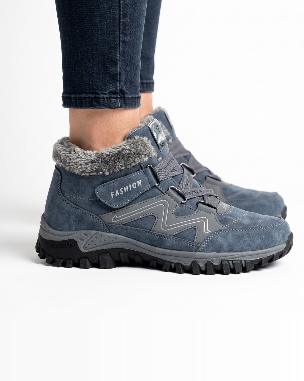 Women’s denim blue fur-lined snow boots with hook-and-loop straps and thick lug sole