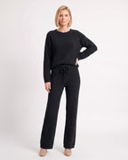 Black fuzzy knit lounge set with crew neck sweater and wide-leg drawstring pants