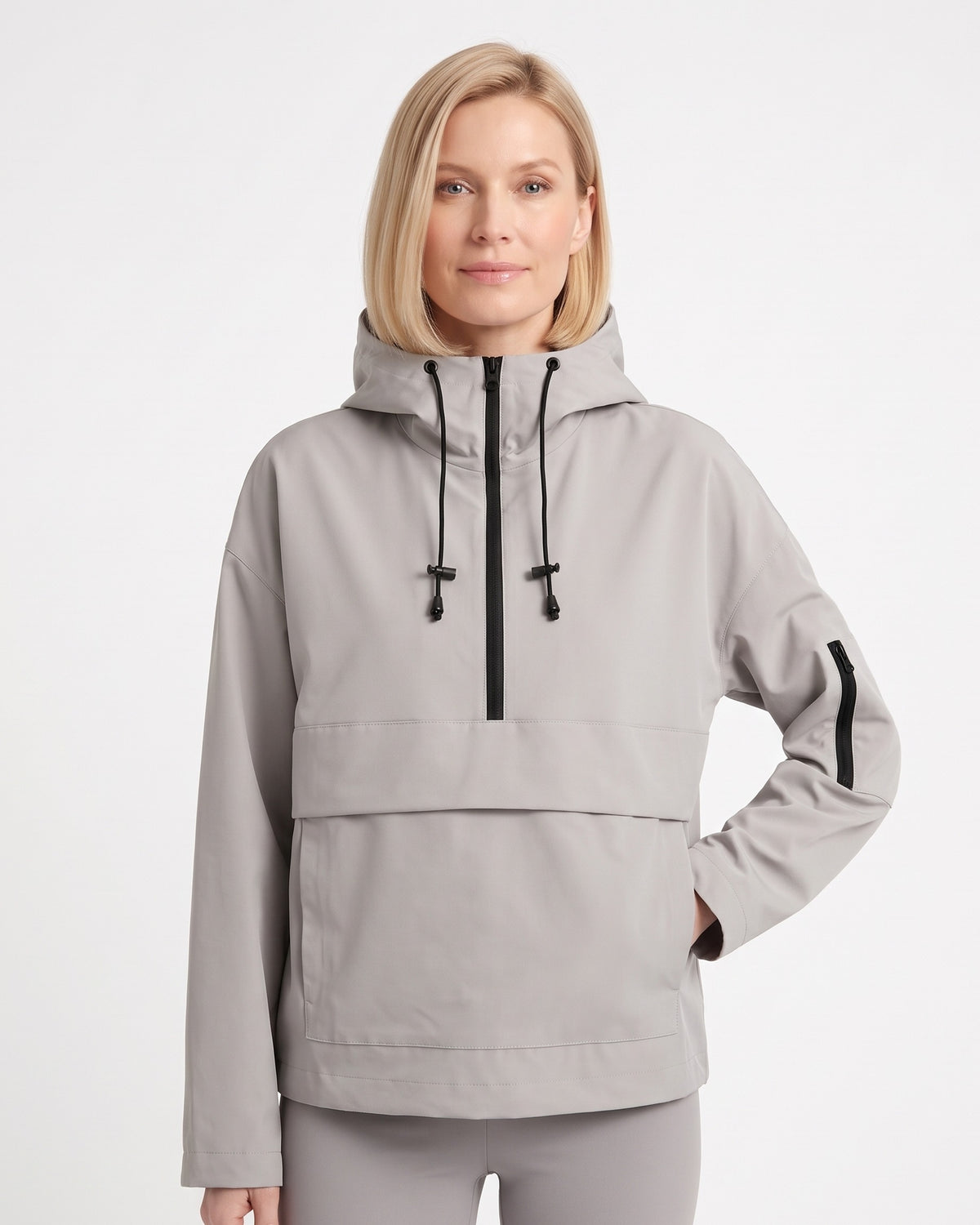 Light gray hooded half-zip anorak jacket with kangaroo pocket and side utility pocket