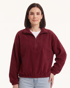 Burgundy half-zip fleece pullover with oversized stand collar and long sleeves
