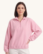 Pink half-zip fleece pullover with oversized stand collar and long sleeves