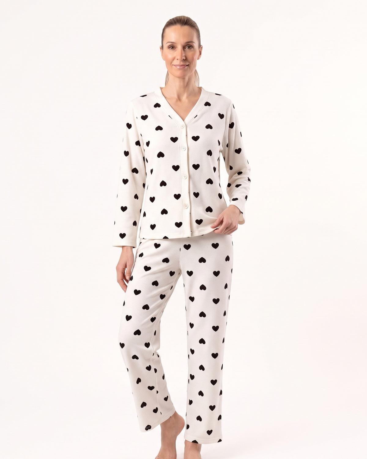 Women’s heart-print pajama set, white fabric with black hearts, long-sleeve top and matching pants