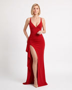 Red maxi evening dress with deep V-neck, ruched bodycon fit, high slit and cascading ruffle