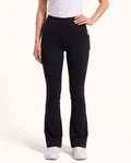 Black high-waist bootcut leggings with front seam and tapered-to-flare legs