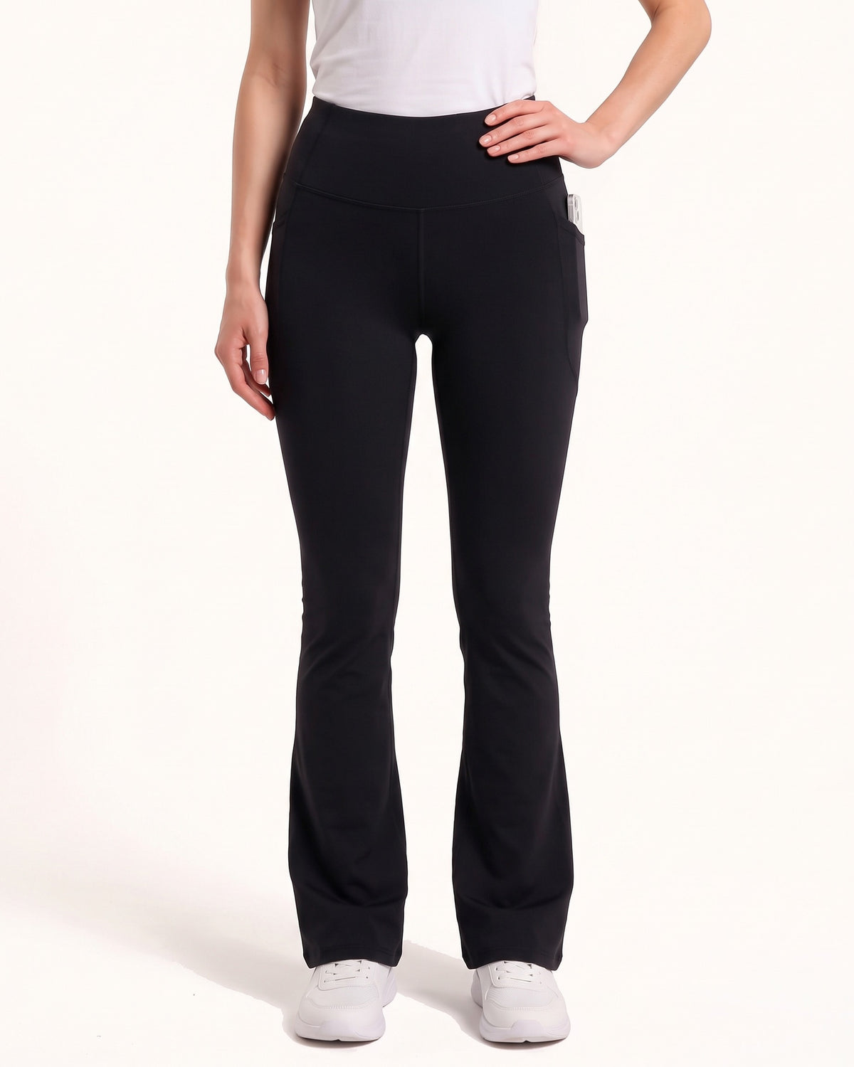 Black high-waist bootcut leggings with front seam and tapered-to-flare legs