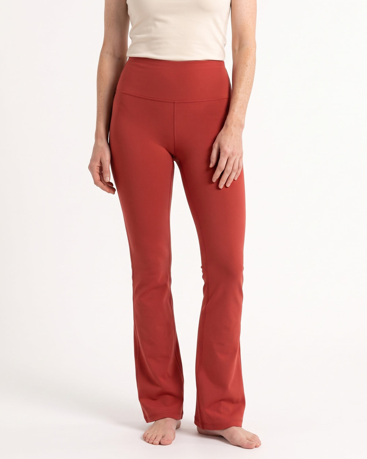 High-waist red flare leggings with tummy-control waistband and contoured back seam